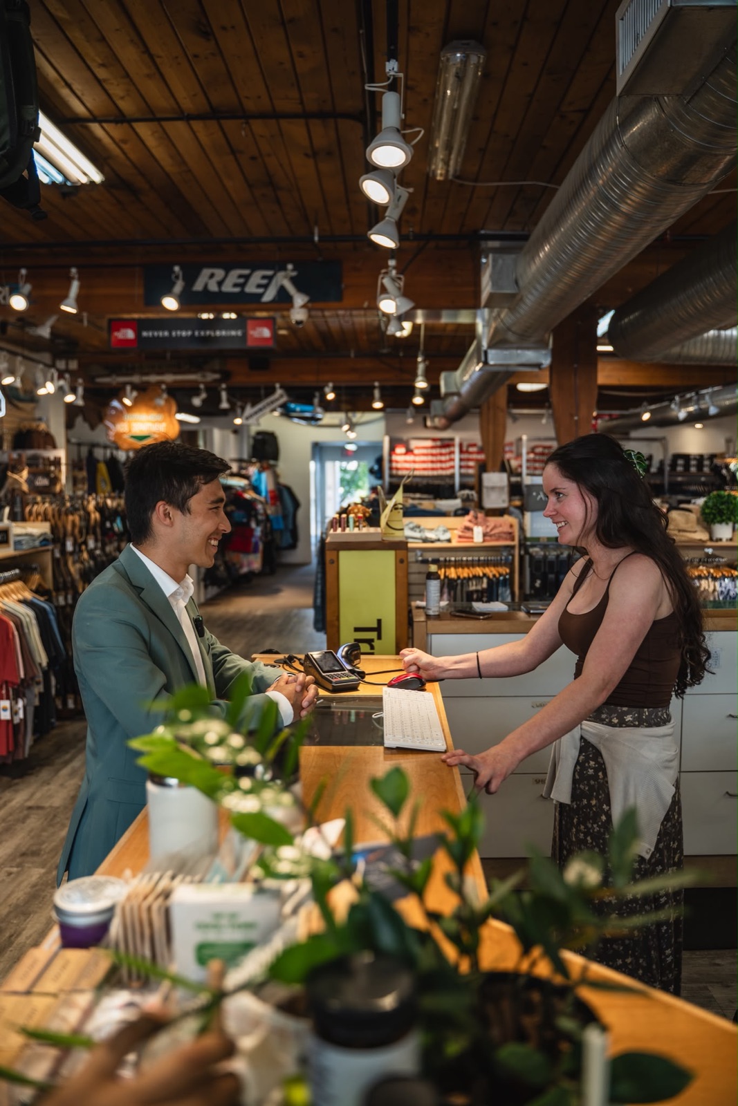 Liam Olsen talking with a local business owner